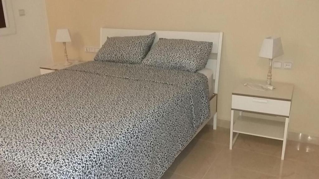 Postel nebo postele na pokoji v ubytování La perle blanche