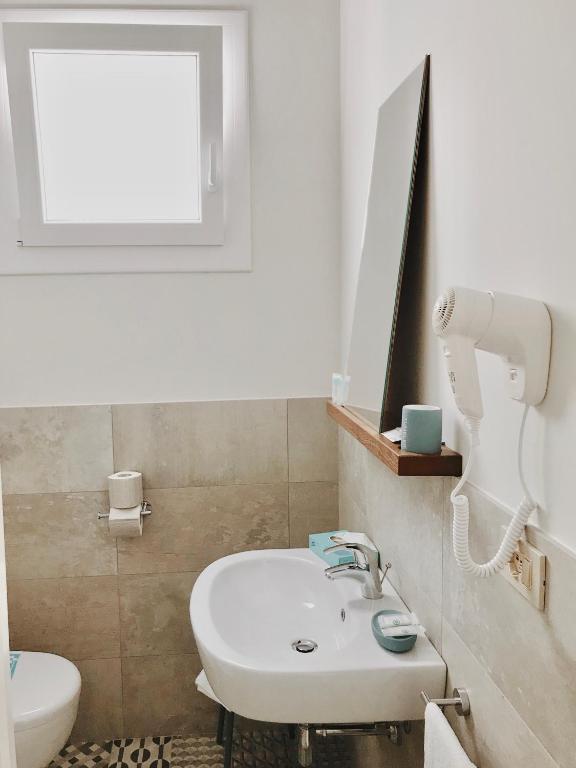 Koupelna v ubytování Hotel Flora