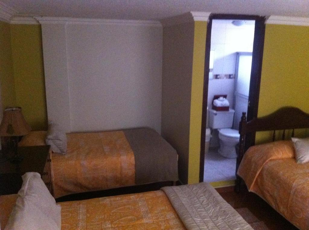 Postel nebo postele na pokoji v ubytování Hotel Margarita 2