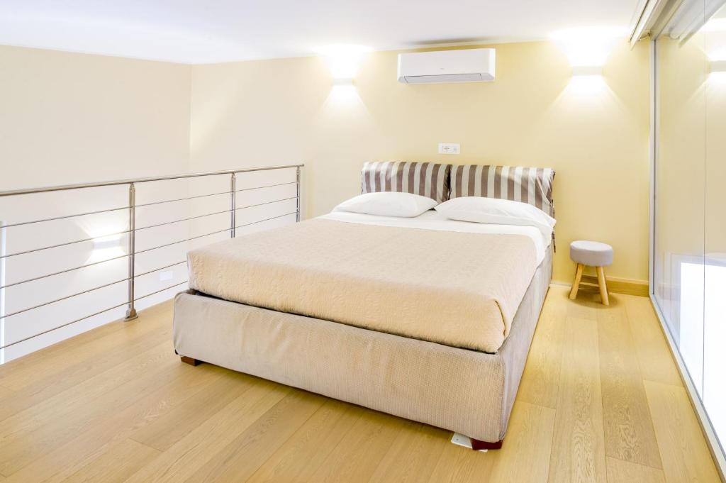 a bedroom with a large bed in a room at Sanremo Home Loft in Sanremo