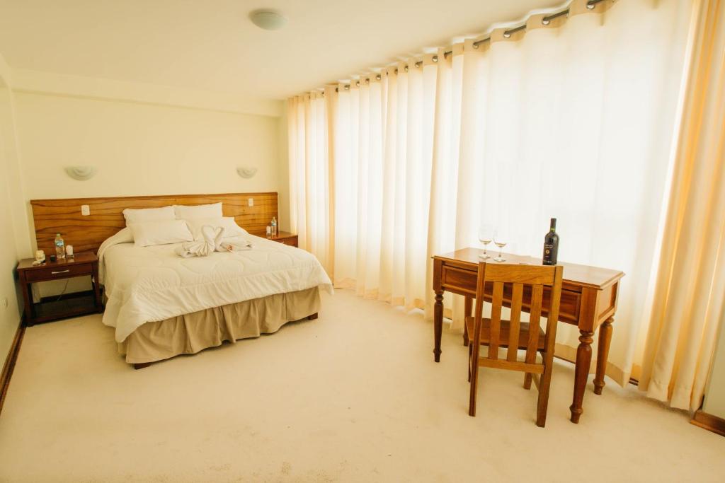 Postel nebo postele na pokoji v ubytování Kaaro Hotel El Buho