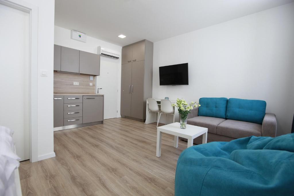 TV a/nebo společenská místnost v ubytování City Center Best Place Apartments