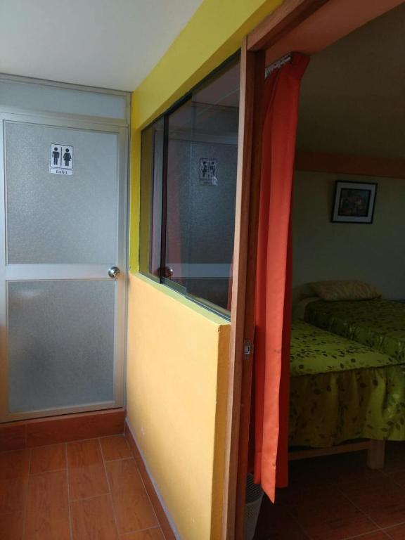 Postel nebo postele na pokoji v ubytování Feliz Vista Casa-Hospedaje