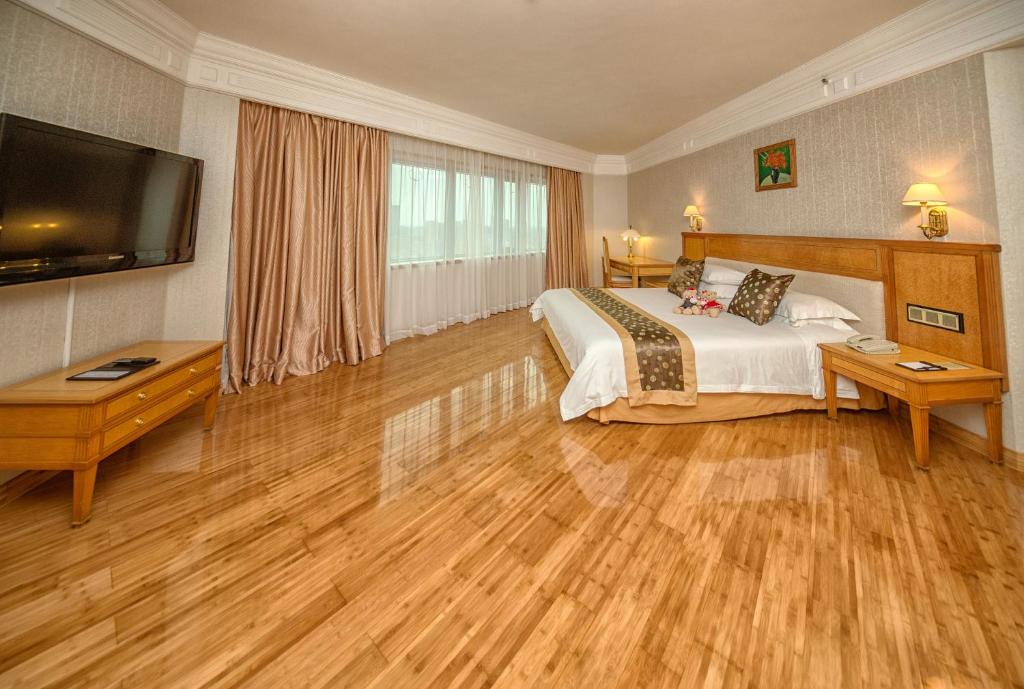 Postel nebo postele na pokoji v ubytování Hotel Silverland