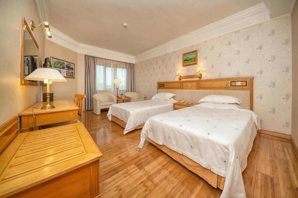 Postel nebo postele na pokoji v ubytování Hotel Silverland