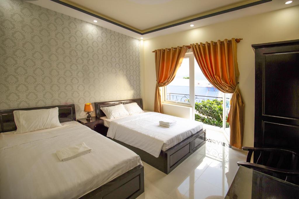 Giường trong phòng chung tại An Phat Hotel