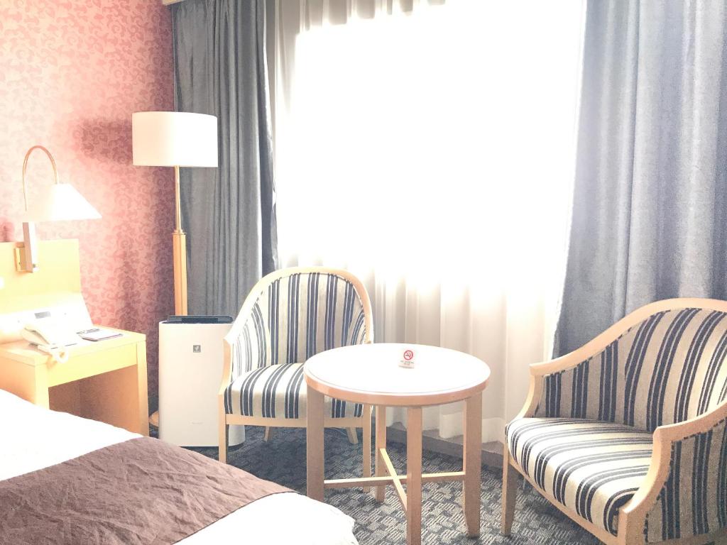 Voodi või voodid majutusasutuse Numazu River Side Hotel toas