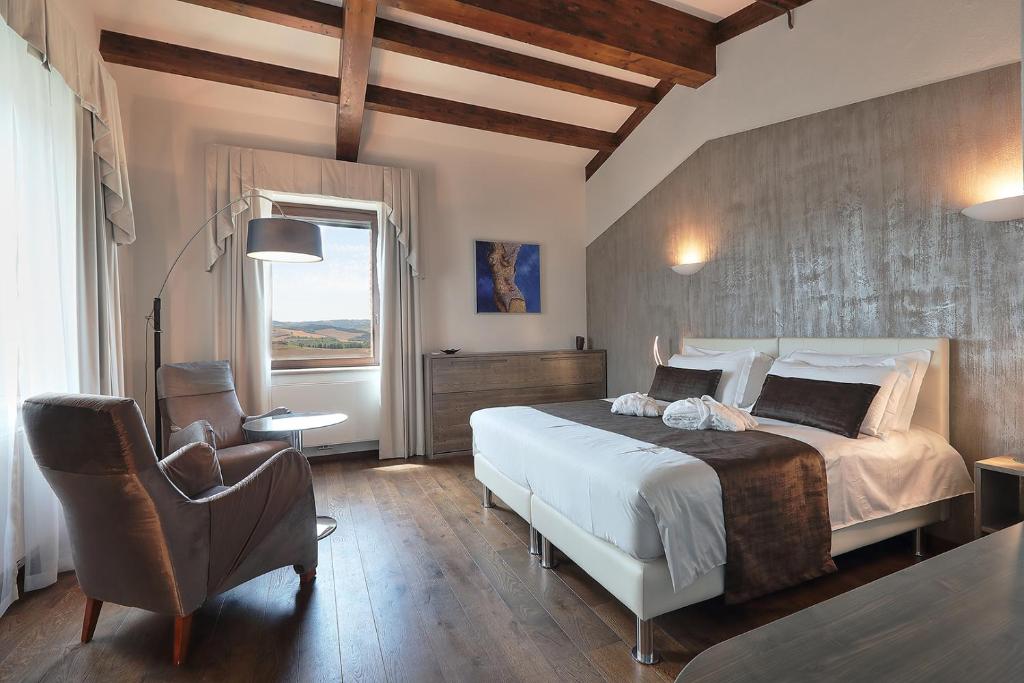 Postel nebo postele na pokoji v ubytování RELAIS VAL D'ORCIA