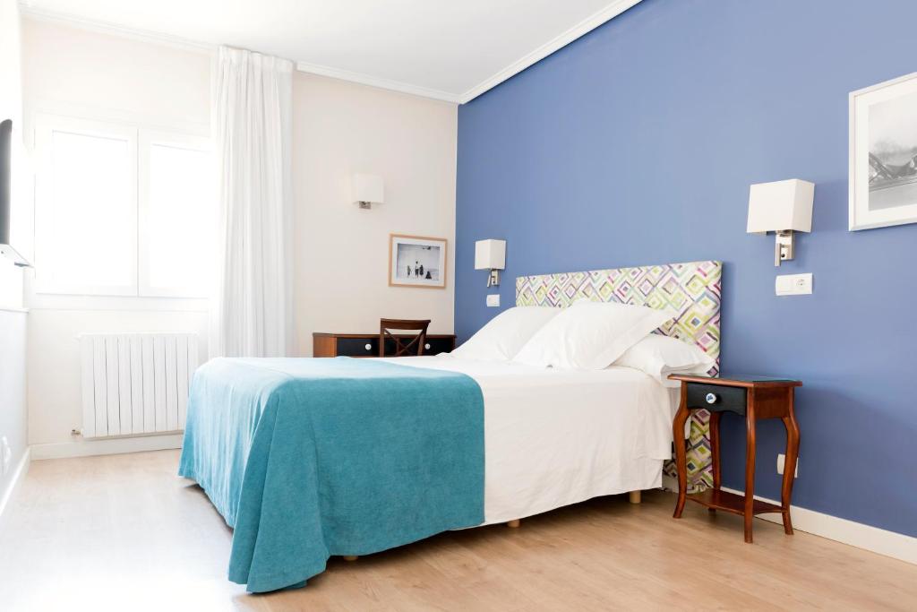 Postel nebo postele na pokoji v ubytování Hotel Sauce
