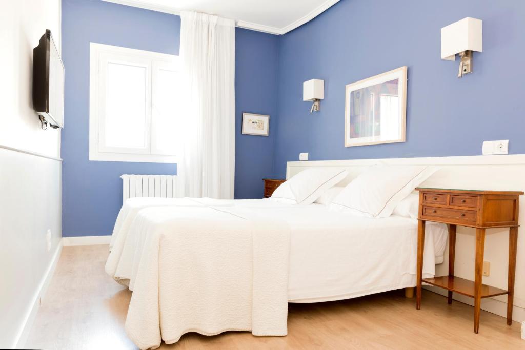 Postel nebo postele na pokoji v ubytování Hotel Sauce