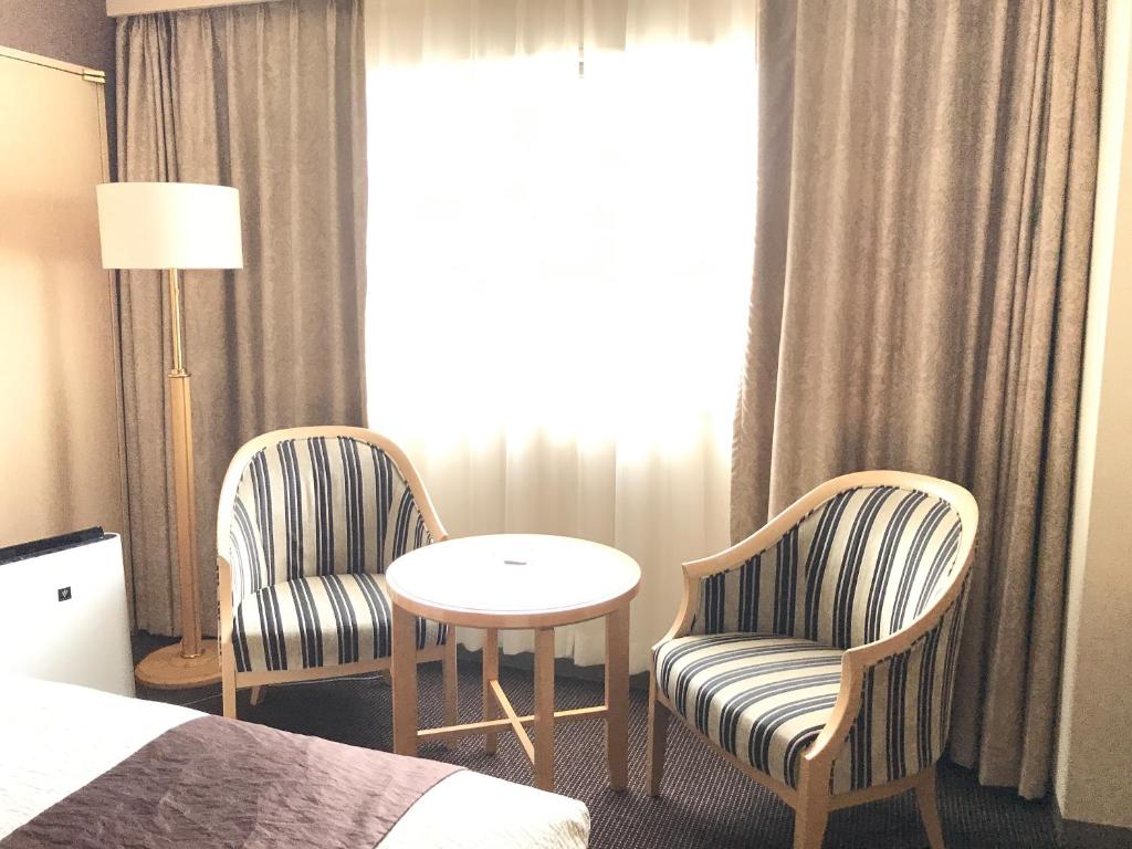 Voodi või voodid majutusasutuse Numazu River Side Hotel toas