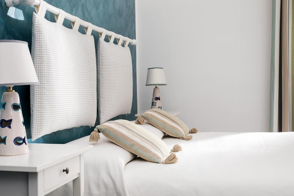 Postel nebo postele na pokoji v ubytování Elisir B&B