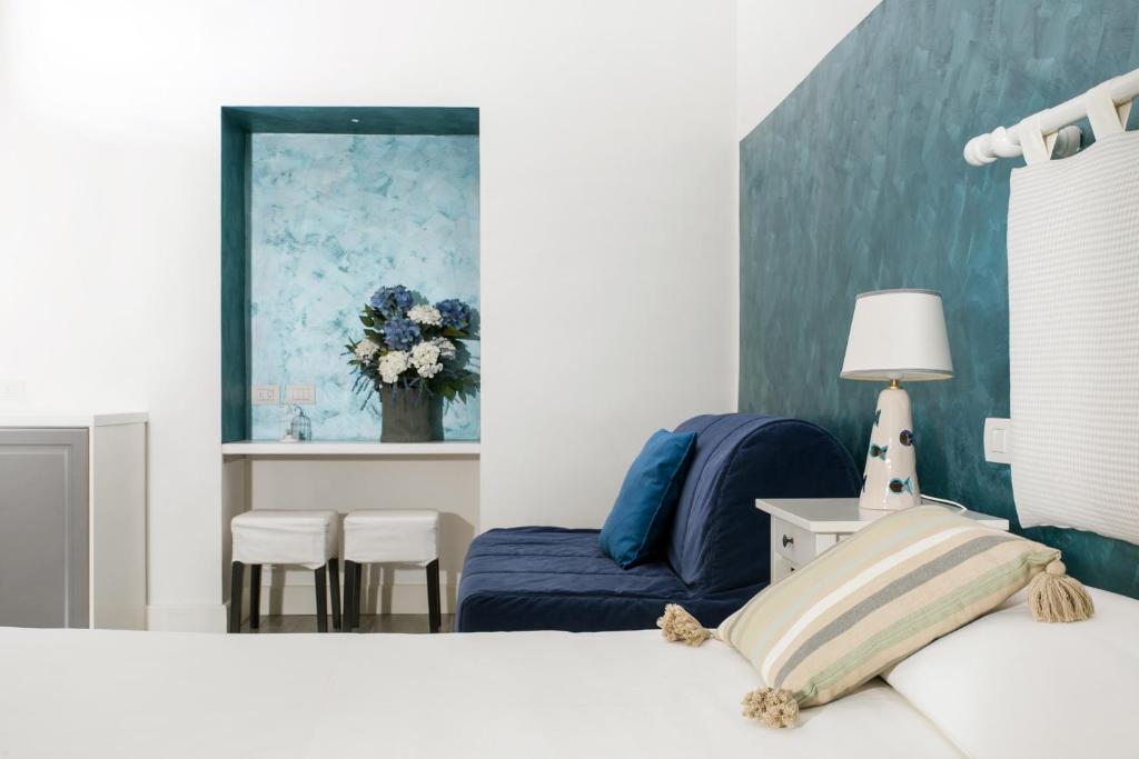 Postel nebo postele na pokoji v ubytování Elisir B&B