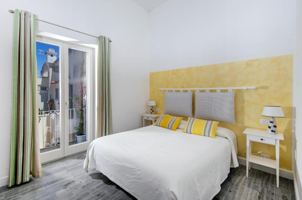 Postel nebo postele na pokoji v ubytování Elisir B&B