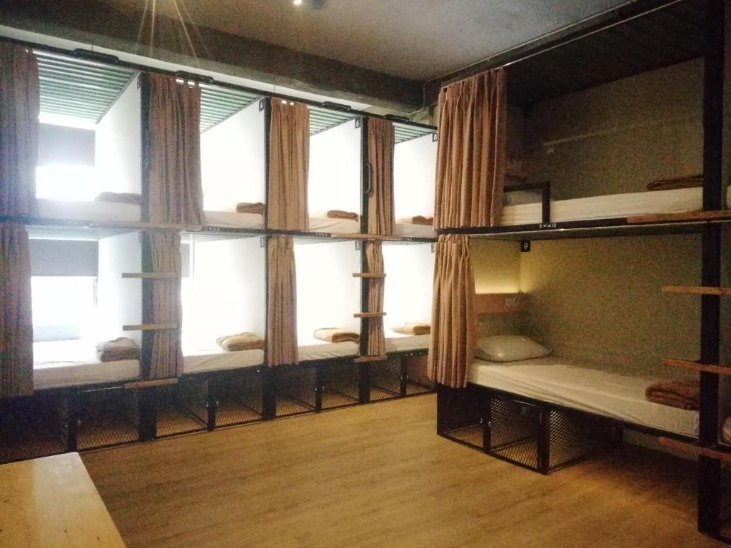 Ένα ή περισσότερα κρεβάτια σε δωμάτιο στο PINX'S HOSTEL