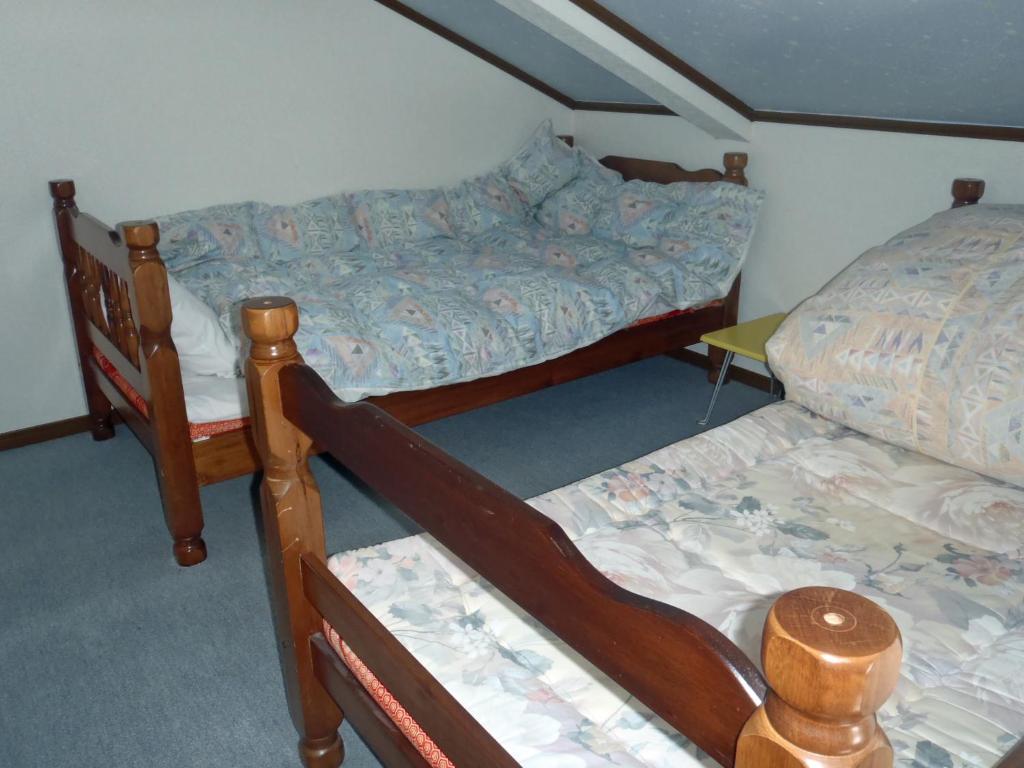Postel nebo postele na pokoji v ubytování Mont Cervin Myoko