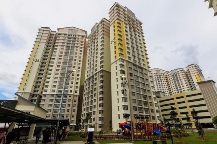 a group of tall buildings with a playground in front at V’Auliya Residence in Putrajaya