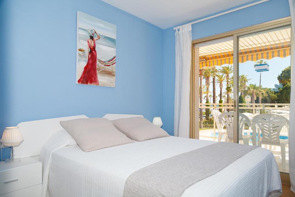 Postel nebo postele na pokoji v ubytování UHC Los Flamencos Family Apartments