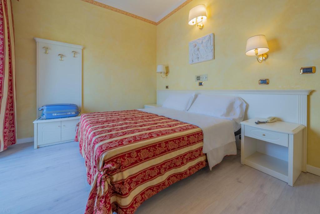Postel nebo postele na pokoji v ubytování Hotel Executive La Fiorita