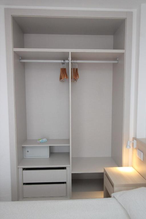 Posteľ alebo postele v izbe v ubytovaní Apartamentos Vistamar