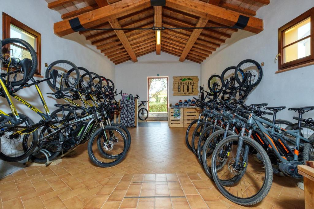 a room with a bunch of bikes parked in it at Poggio all'Agnello Sport & Family Holidays in Populonia