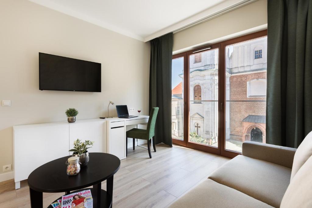 Televízia a/alebo spoločenská miestnosť v ubytovaní Liza Lux Apartments I Old Town