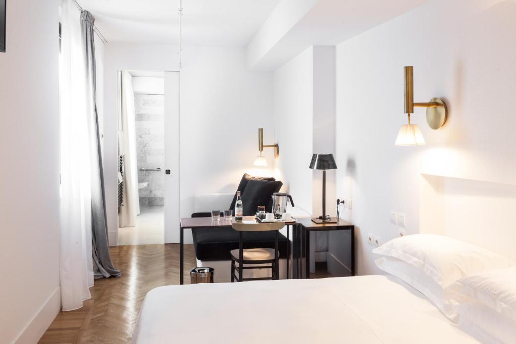 Postel nebo postele na pokoji v ubytování Senato Hotel Milano