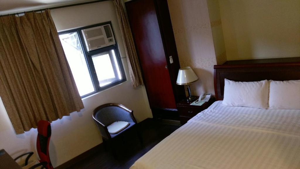 Postel nebo postele na pokoji v ubytování Dory Inn