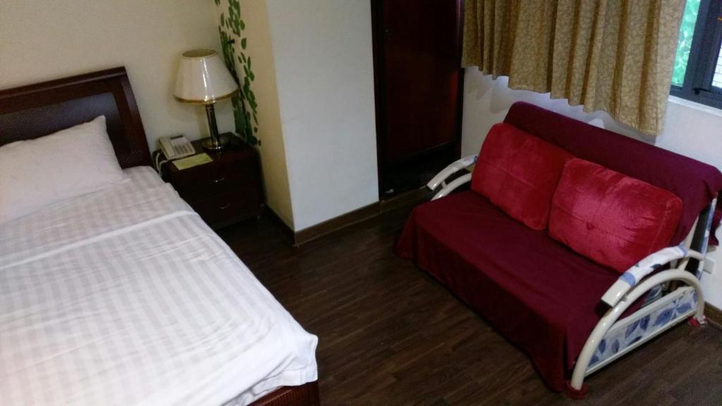 Postel nebo postele na pokoji v ubytování Dory Inn
