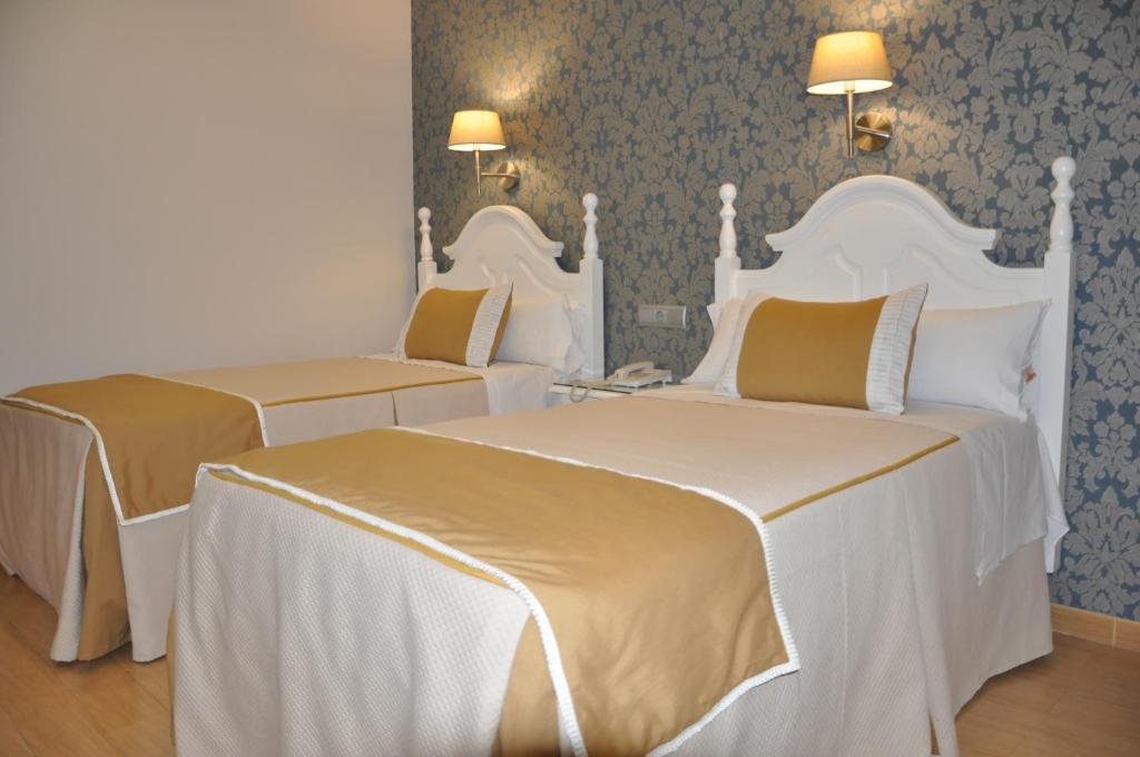 Postel nebo postele na pokoji v ubytování Hotel Selu