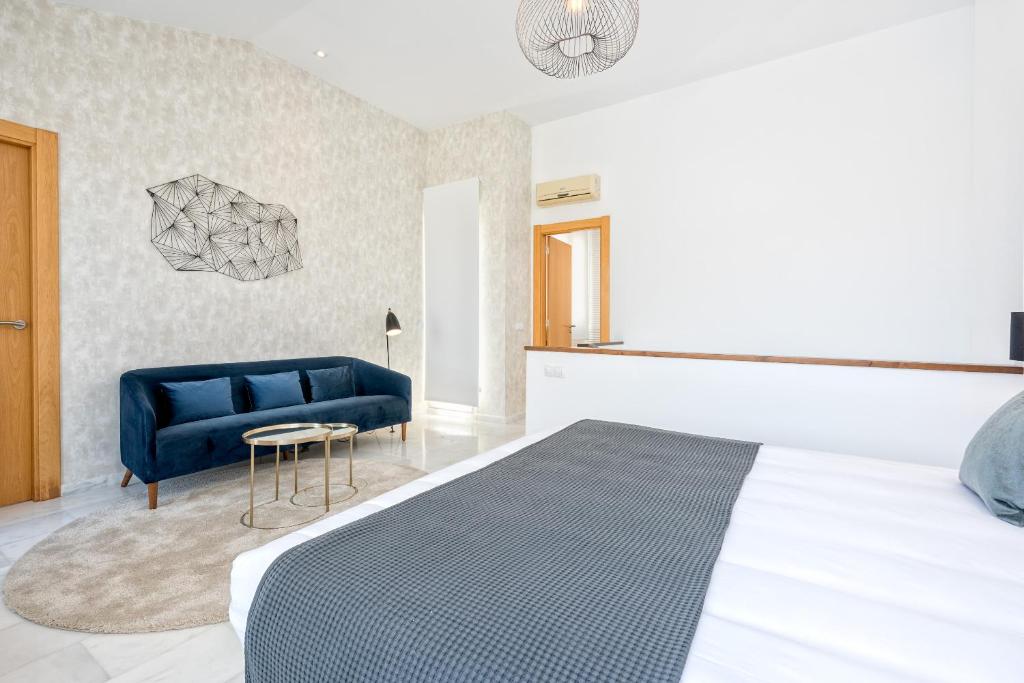 Posteľ alebo postele v izbe v ubytovaní iloftmalaga Deluxe Alameda Principal