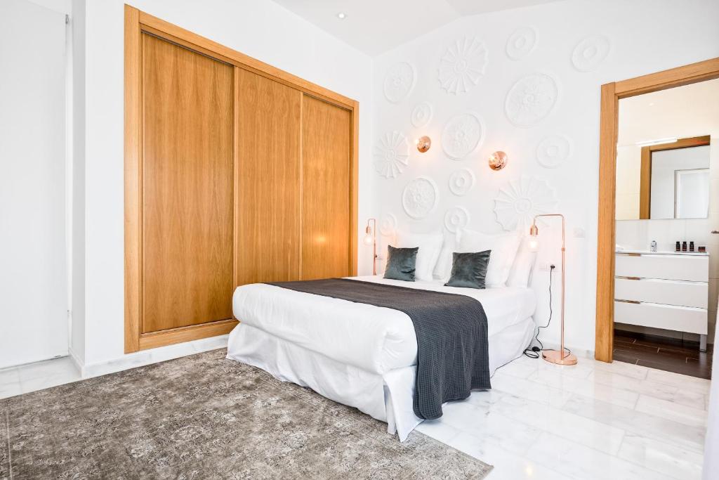 Posteľ alebo postele v izbe v ubytovaní iloftmalaga Deluxe Alameda Principal
