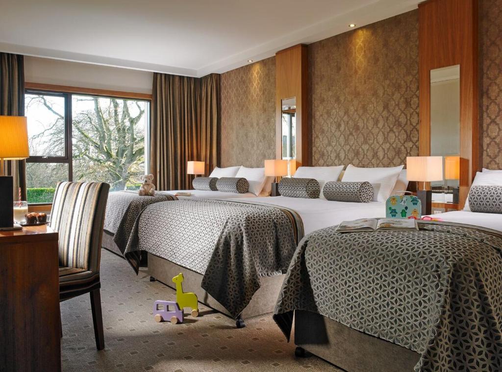 Letto o letti in una camera di Newpark Hotel