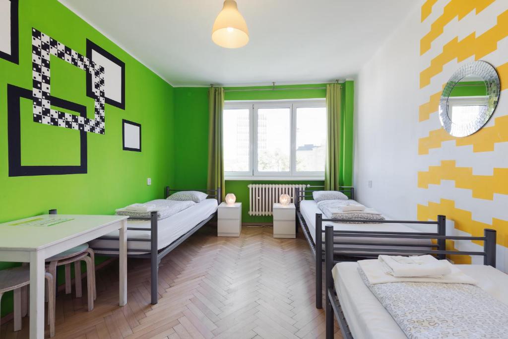 Postel nebo postele na pokoji v ubytování Patio Hostel
