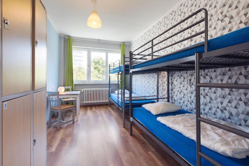 Postel nebo postele na pokoji v ubytování Patio Hostel