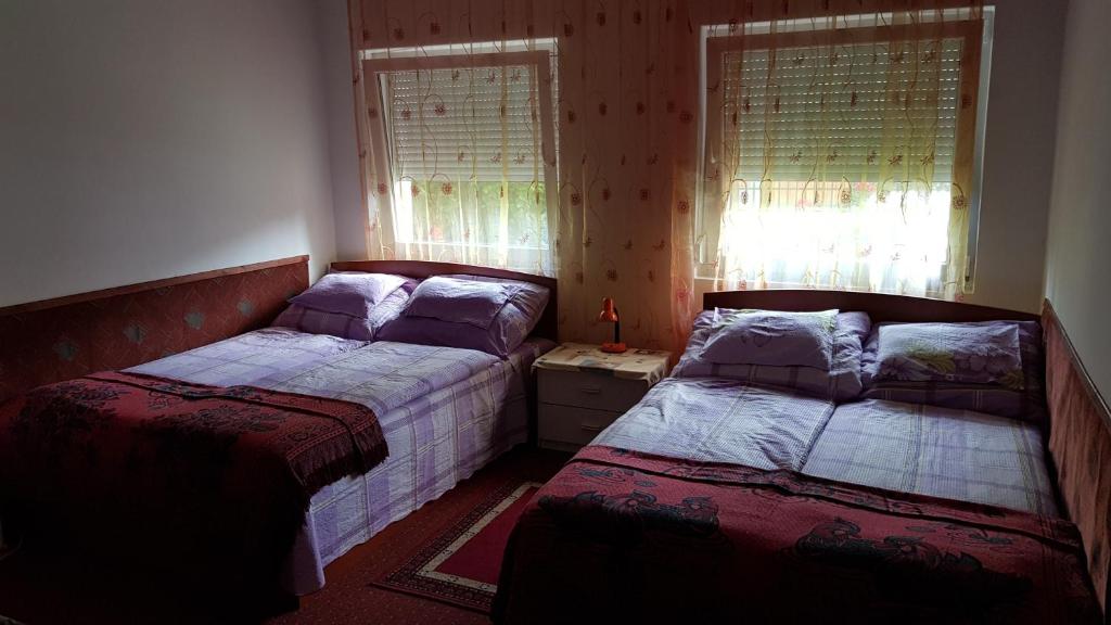 Postel nebo postele na pokoji v ubytování Mészöly Vendégház