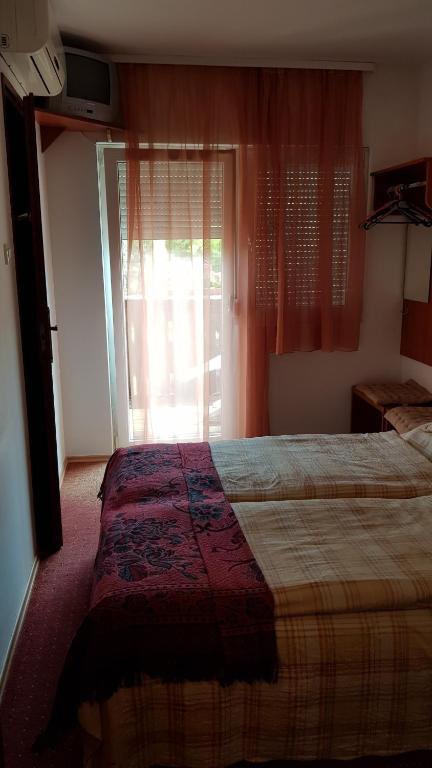 Postel nebo postele na pokoji v ubytování Mészöly Vendégház