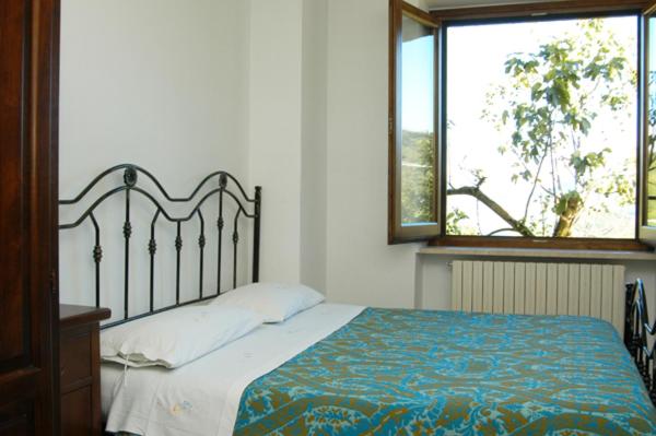 Ένα ή περισσότερα κρεβάτια σε δωμάτιο στο Agriturismo I Due Regni