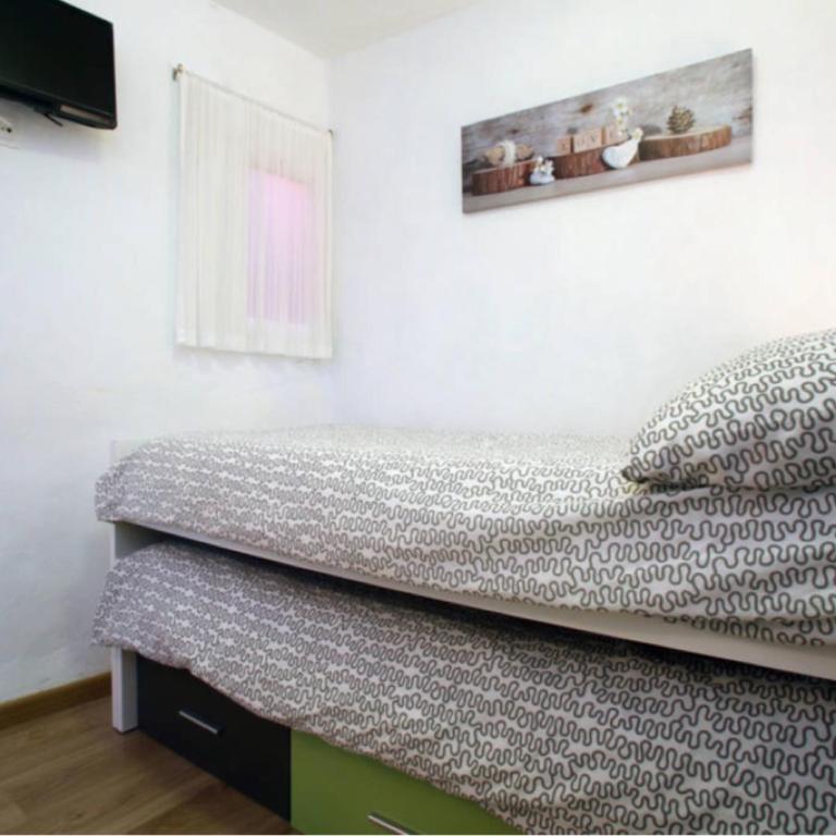 Postel nebo postele na pokoji v ubytování Casa las tres Conchas
