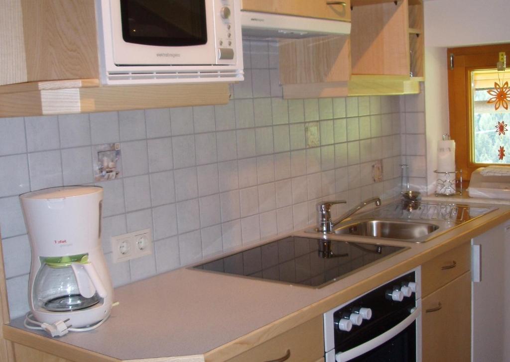 Kuchyň nebo kuchyňský kout v ubytování Gästehaus Lanzinger