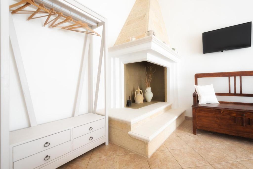 Postel nebo postele na pokoji v ubytování B&B Li Tarici