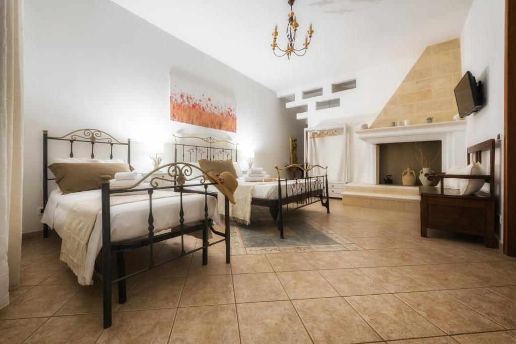 Postel nebo postele na pokoji v ubytování B&B Li Tarici