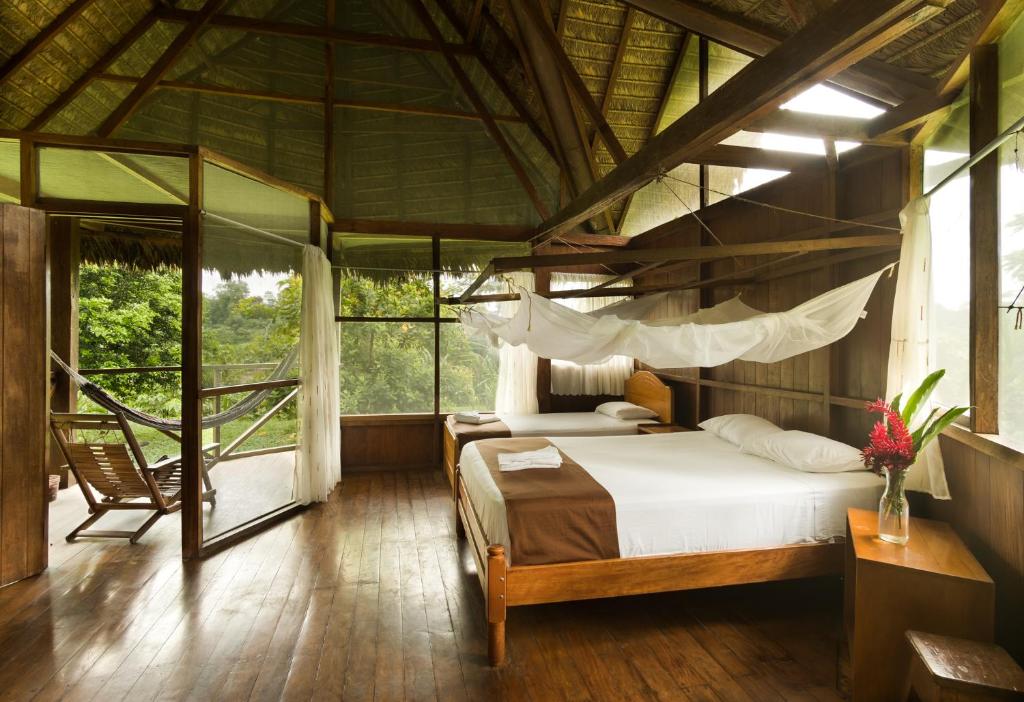 Postel nebo postele na pokoji v ubytování Wasai Tambopata Lodge