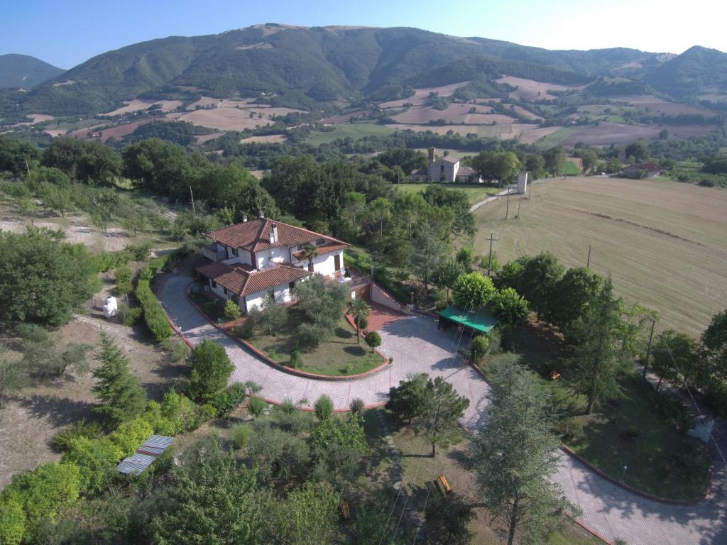 an aerial view of a house in the mountains at B&B La Poiana in Urbino