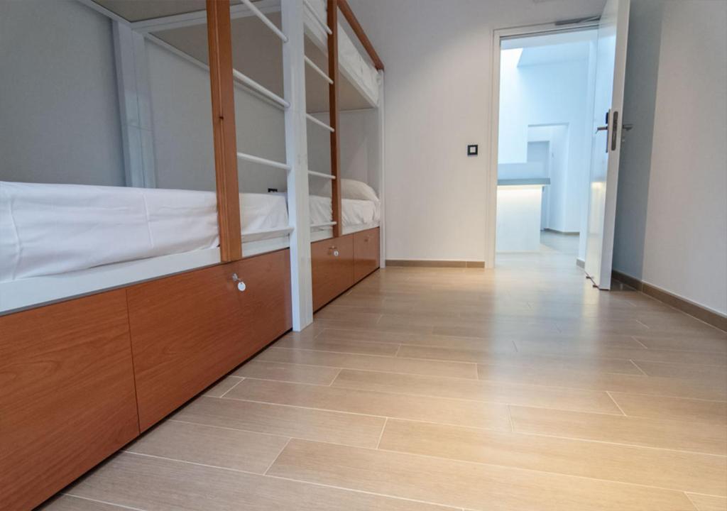 A bed or beds in a room at Youth Hostel Jávea