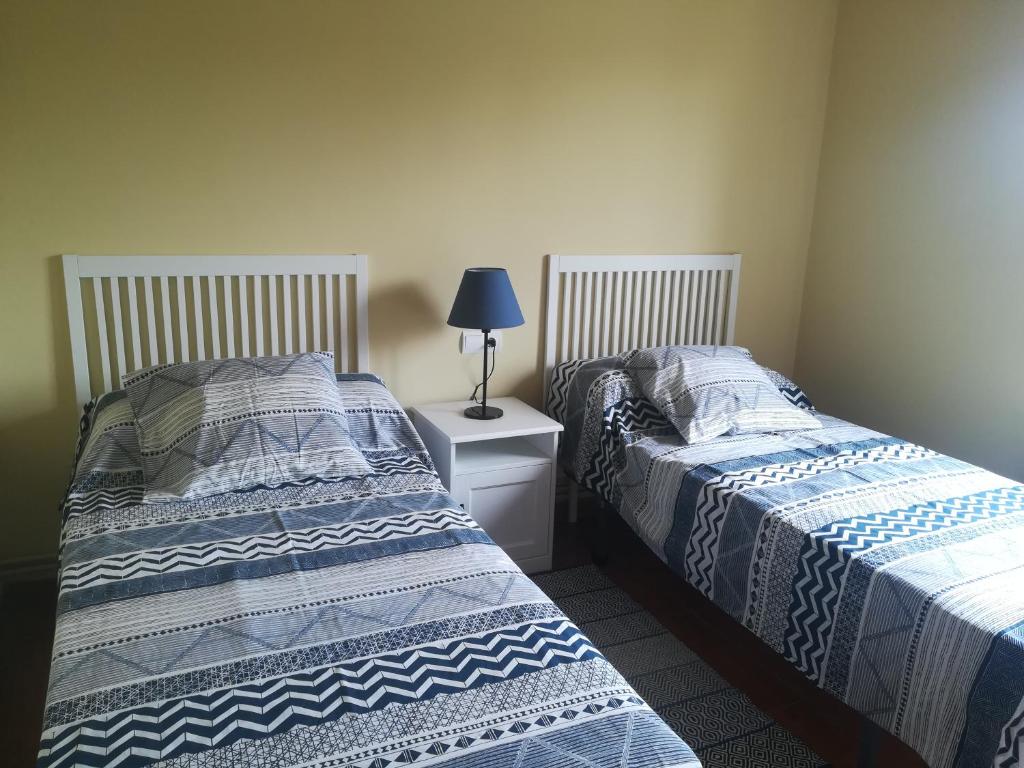 A bed or beds in a room at Casa Rural La Rasilla