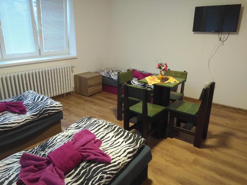 A bed or beds in a room at Ubytovanie Janka