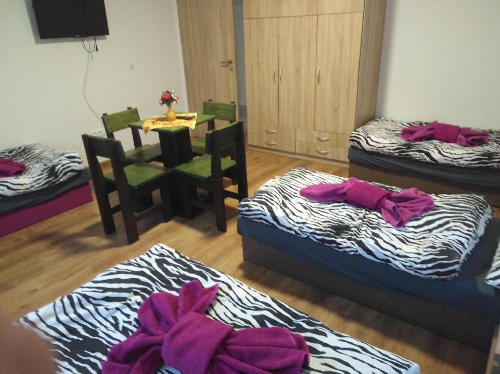 A bed or beds in a room at Ubytovanie Janka