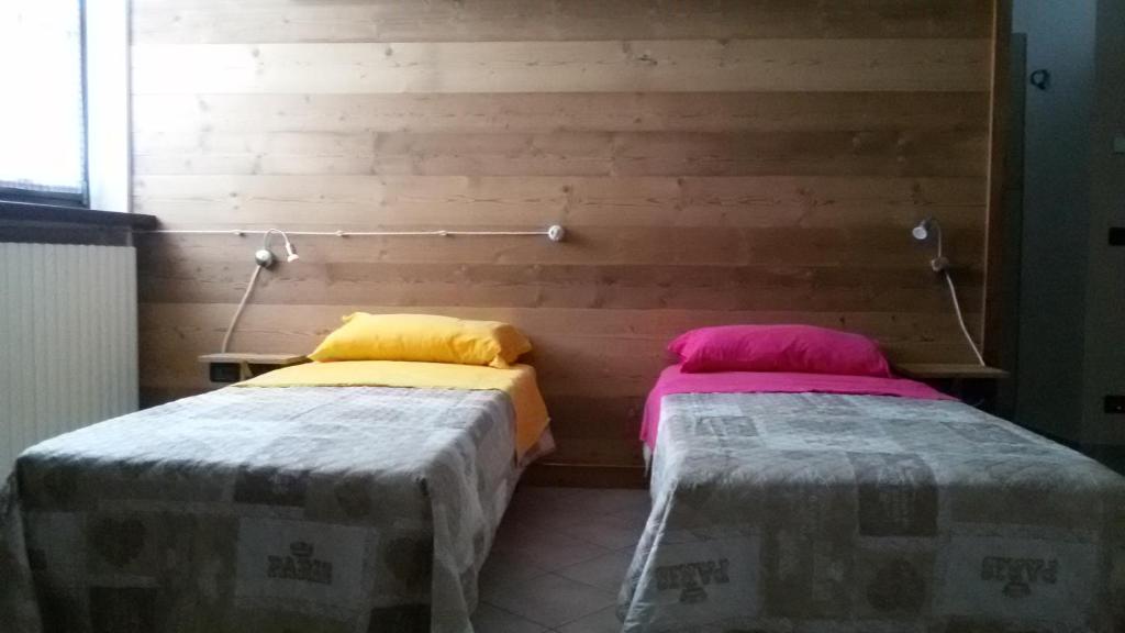 Postel nebo postele na pokoji v ubytování La Fisarmonica