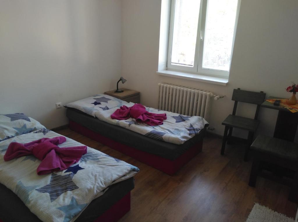 A bed or beds in a room at Ubytovanie Janka